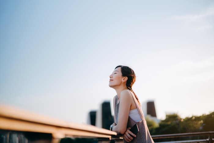 Woman enjoying the outside air.